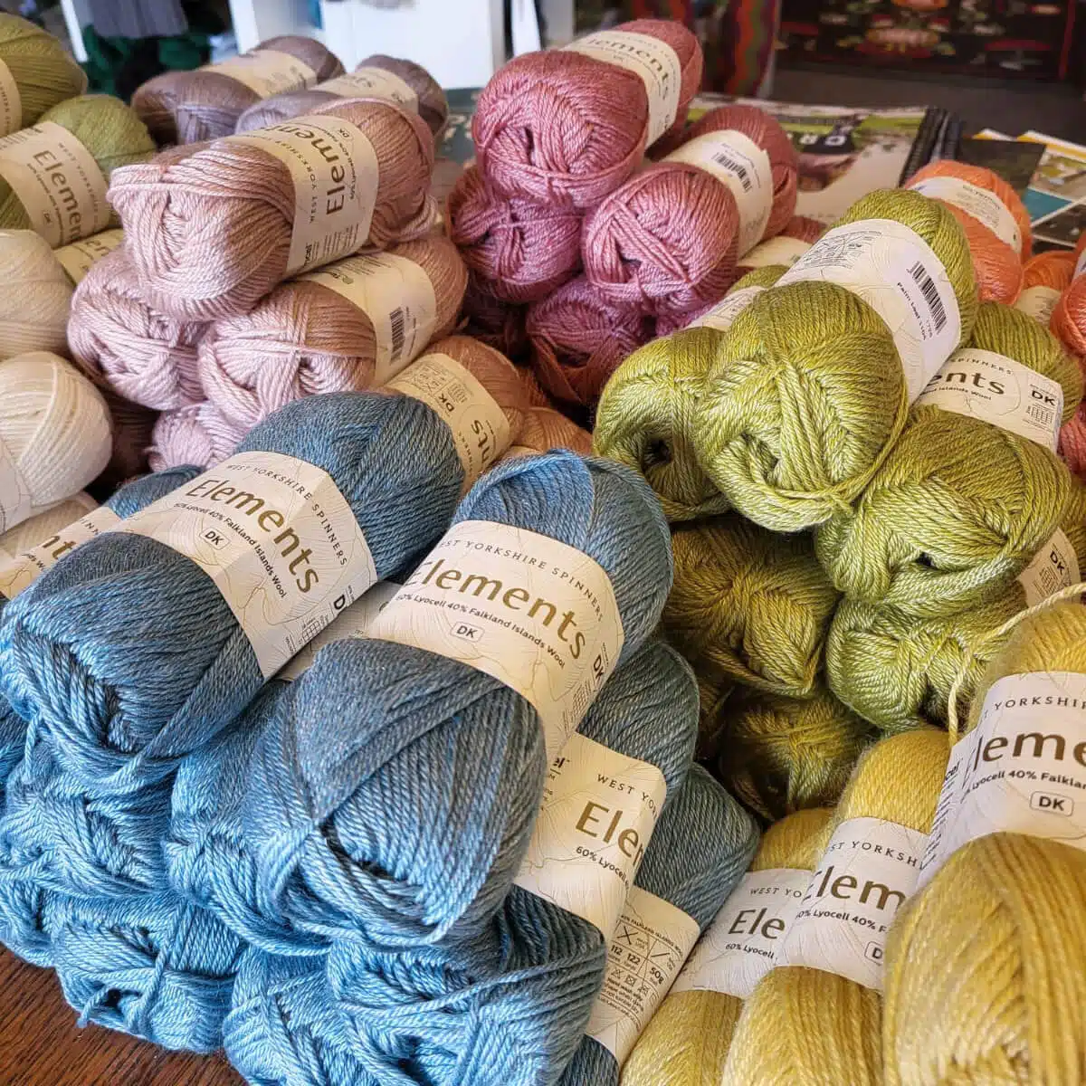 Table full of West Yorkshire Spinners yarn